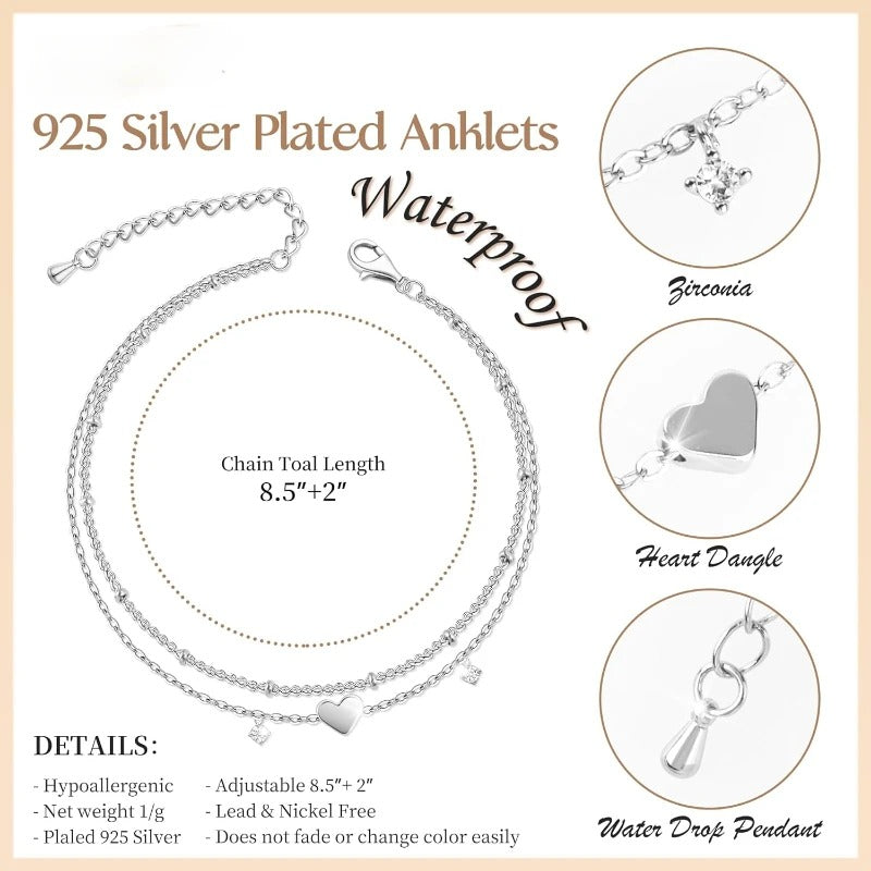 925 silver-plated anklet set with chain toal length 8.5"+2" and three circular detail insets showing the Zirconia charm, heart dangle, and water drop pendant, on a light beige background with product details text.