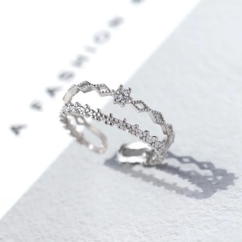 Carter and Laurent Etoile silver floral adjustable ring